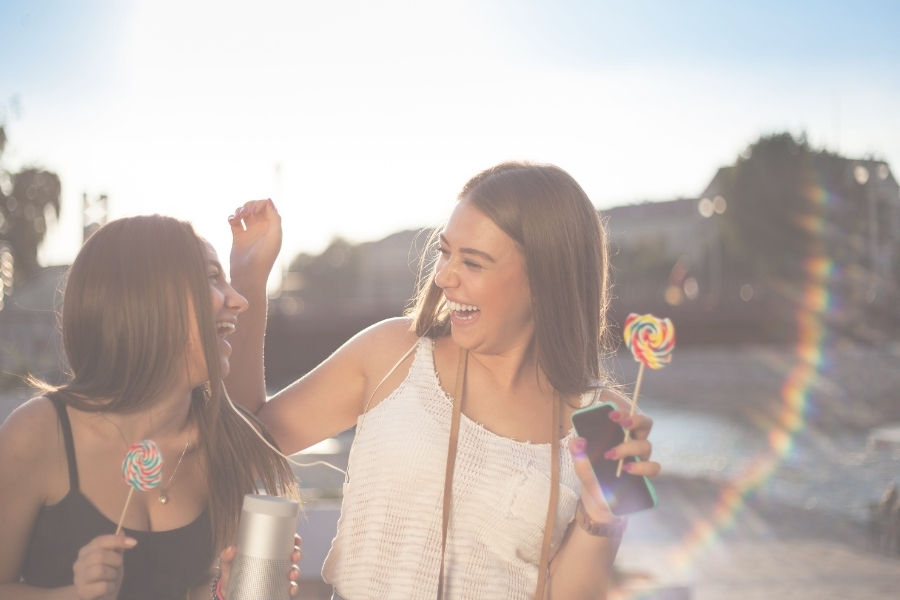 Two girls laughing together