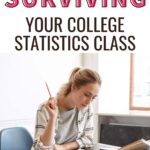 A girl sitting at her desk reading a textbook. The text overlay reads, "The Ultimate Guide to Surviving Your College Statistics Class"